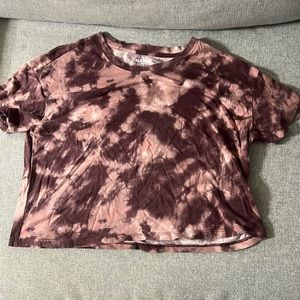 light, pink, and burgundy tie-dye crop top shirt